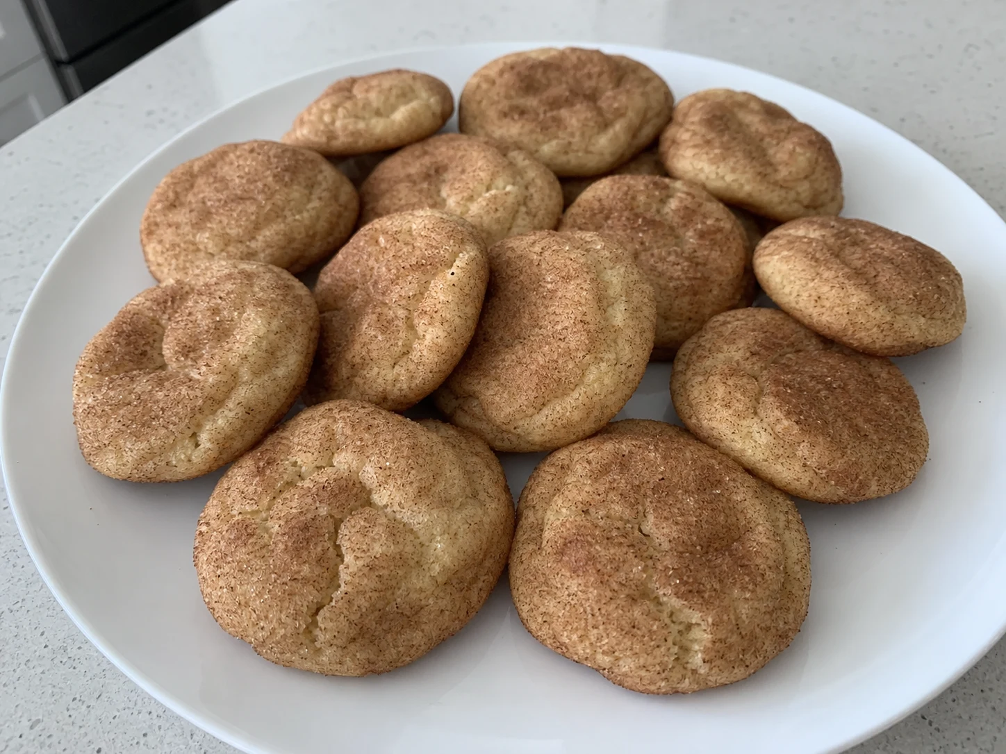 Homemade snickerdoodle cookies covered in cinnamon sugar